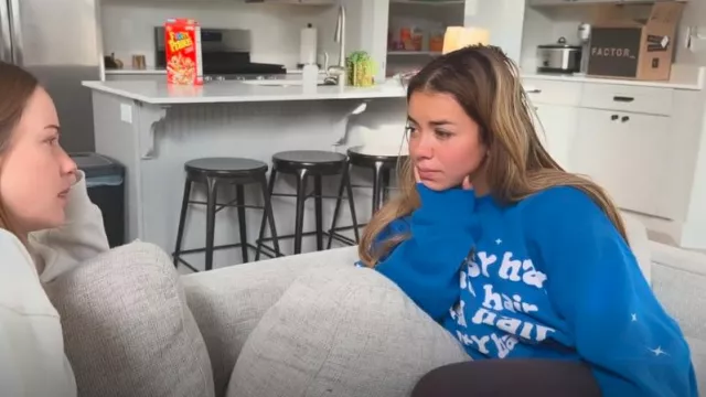 JZ Style Blue Who Cares Graphic Crewneck Sweatshirt worn by Jen Affleck as seen in The Secret Lives of Mormon Wives (S02E06)