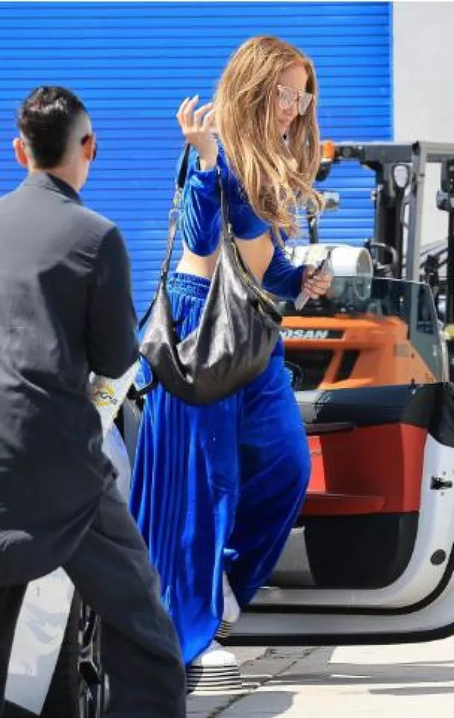 Adidas x Jeremy Scott Blue Velvor Velvet Crop Track Jacket worn by Jennifer Lopez in Dance Studio post on June 13, 2025