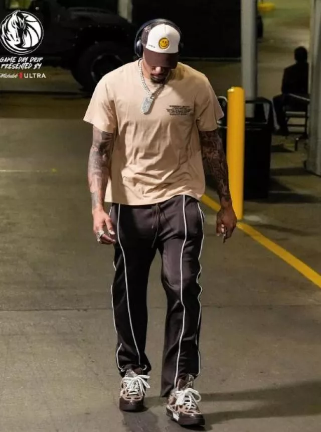 Amiri Brown Piped Western Trackpants worn by Paul Jamaine Washington Jr. on the Instagram account @dallasmavs