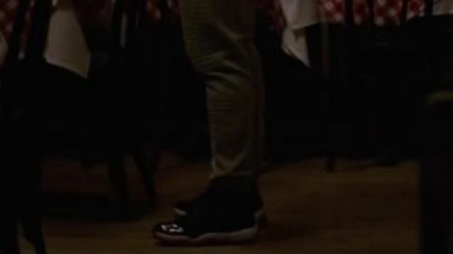 La paire de sneakers Nike Air Jordan 11 "Bred" portée par Adonis Creed (Michael B. Jordan) dans Creed : L'héritage de Rocky Balboa