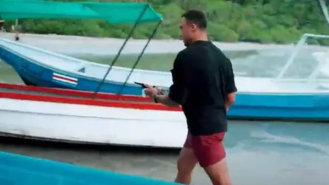 Orlebar Brown Automobili Lamborghini Hexagon Jacquard Mid-Length Swim Shorts in Black/Summer Red worn by Dale Moss as seen in Bachelor in Paradise (S10E08)