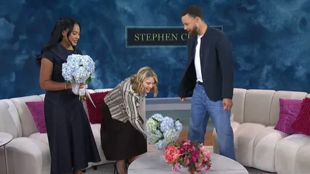Jacquemus Triangle de-Nîmes Denim Skirt worn by Ayesha Curry as seen in Today with Jenna & Friends on September 10, 2025