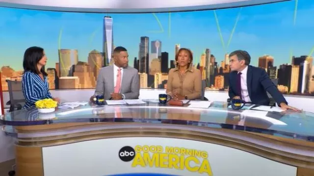 Maje Rayemitte Robe midi à ourlet asymétrique portée par Tara Narula comme on le voit dans Good Morning America le 23 septembre 2025