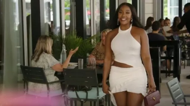 Bottega Veneta Andiamo Clutch worn by Jassi Harris as seen in The Real Housewives of Potomac (S10E03)