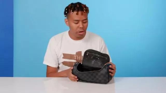 Louis Vuitton Graphite Damier Toiletry Bag worn by YBN Cordae in 10 Things YBN Cordae Can't Live Without | GQ