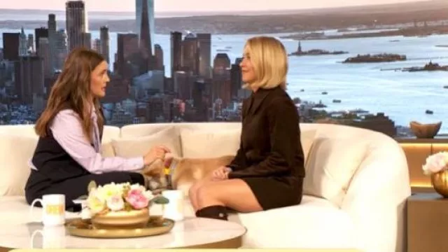 Miu Miu Miuccia Suede Shirtdress worn by Sydney Sweeney as seen in The Drew Barrymore Show on November 7, 2025