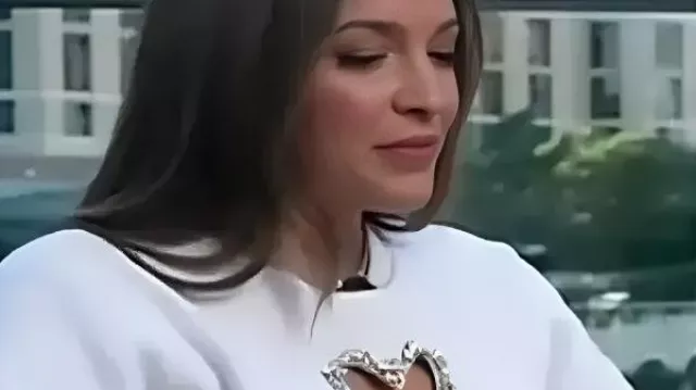Emily Orozco Embellished Heart Cutout T-Shirt worn by as seen in Access Hollywood