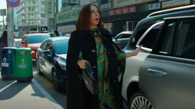 Valentino Garavani Medium Rockstud Spike Shoulder Bag worn by Molly Novak (Maya Rudolph) as seen in Loot (S03E07)