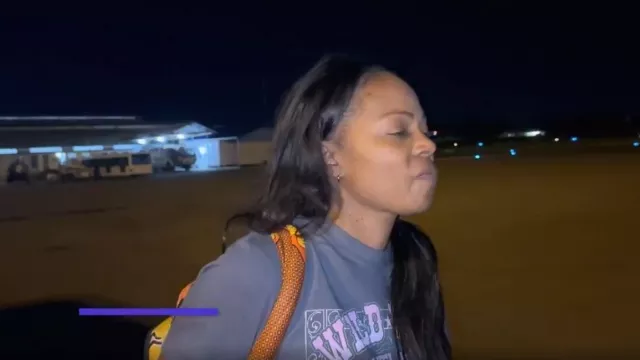 Mud & Moo Boutique Wild West Graphic Tee worn by Sparkle Clark as seen in Tiffany Haddish Goes Off (S01E05)