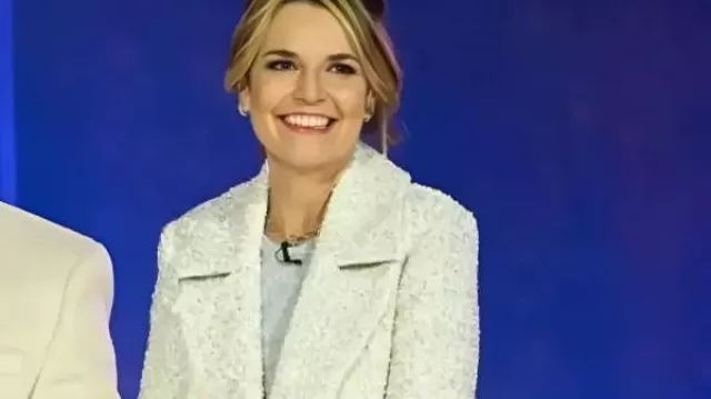 Christmas In Rockefeller Center 2025 Savannah Guthrie White Long Coat worn by Savannah Guthrie in Reba McEntire, Rockettes & Starry Performances At Rockefeller Christmas Tree Lighting | No Intervals