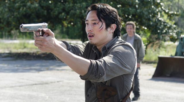 The pistol to Glenn (Steven Yeun) in The Walking Dead