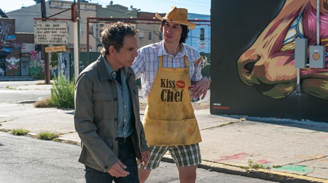 The apron yellow "Kiss The Chef" Jamie (Adam Driver) in ' While We're Young