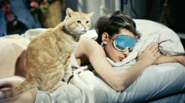 Stoppers ear of Holly Golightly (Audrey Hepburn) in Breakfast at Tiffany's