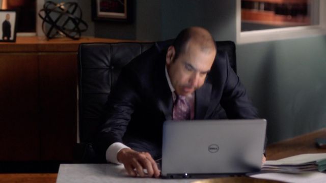 The computer gray Dell of Louis Litt (Rick Hoffman) in "Suits"