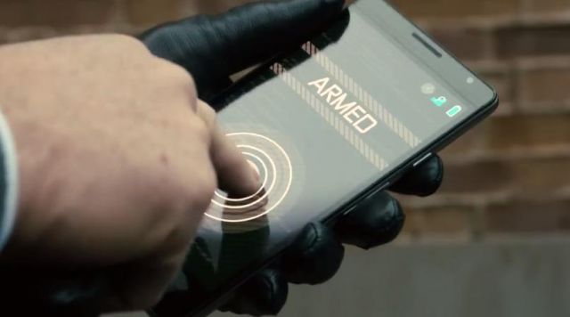 The smartphone black-The Watchmaker (Pierce Brosnan) in "Survivor"