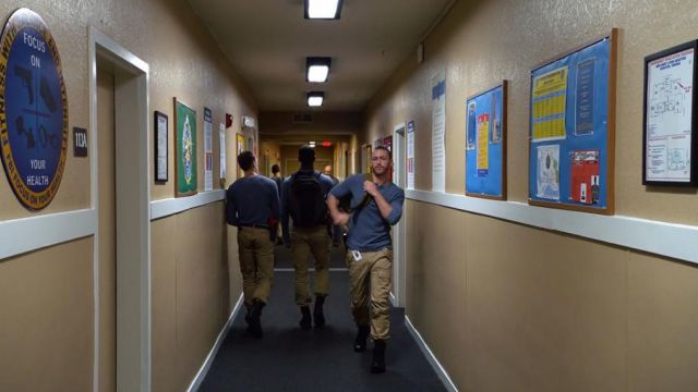 The tan pants of Caleb Haas (Graham Rogers) in Quantico