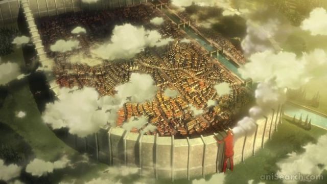 colossal titan attacks wall