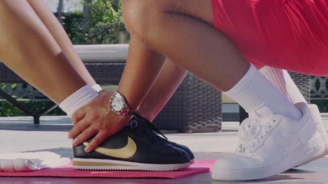 The pair of Nike Cortez black and gold 