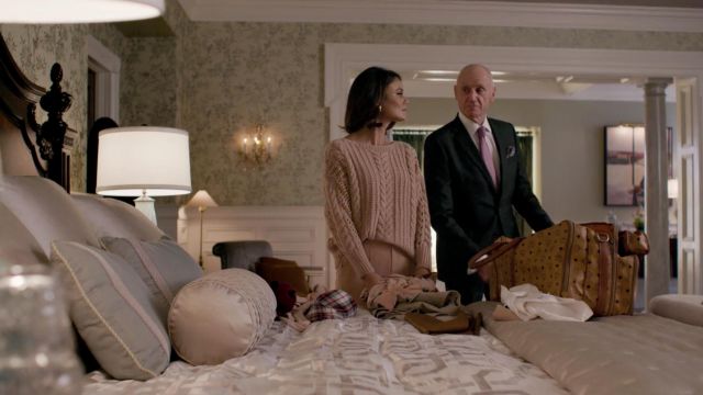 The pale pink knit sweater by Ryan Roche worn by Crystal Flores (Nathalie Kelley) in Dynasty 1x04