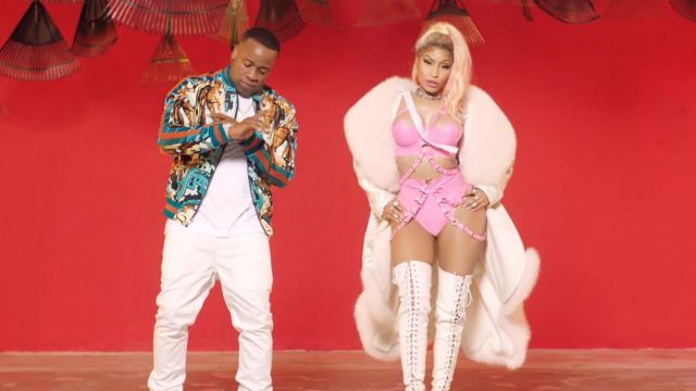The waders in the white Nicki Minaj in her video clip Rake it up