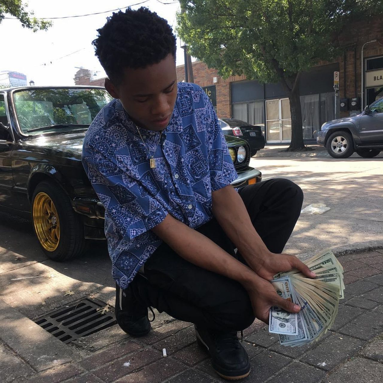 The blue shirt pattern bandana Tay-K on his account Instagram @Tayk47shawty...