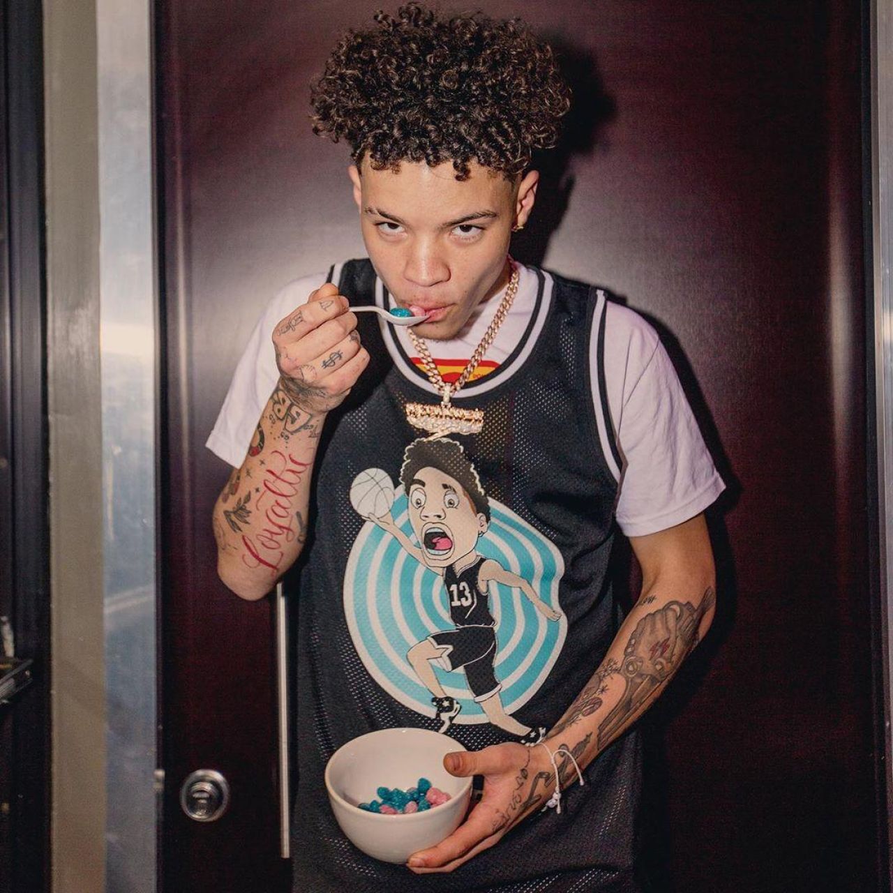 The tank top worn by Lil Mosey on his account Instagram @lilmosey.