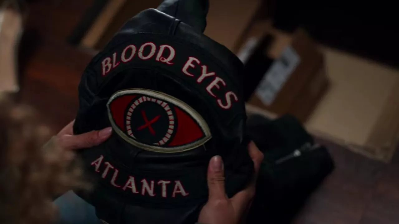 The black leather jacket "Blood Eyes Atlanta" by Miller (Nikki Roumel) in the series