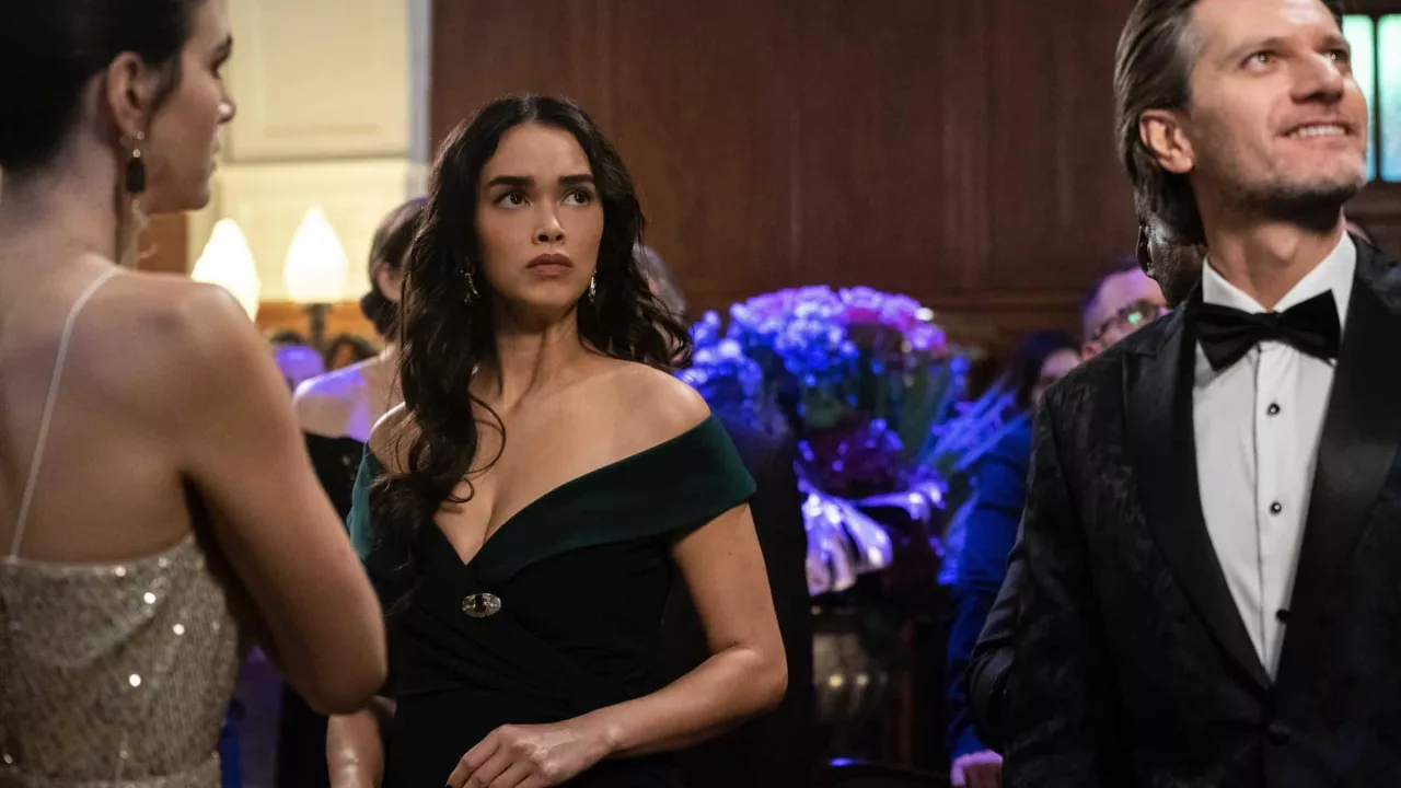 Off the shoulder green dress worn by Special Agent Cameron Vo (Vinessa