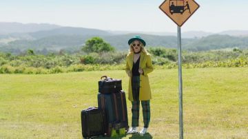 The bag's yellow Cora Hamilton (Debby Ryan) in Rip Tide