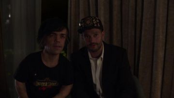 The black t-shirt Universal Studios worn by Hervé Villechaize (Peter Dinklage) in My Dinner With Hervé