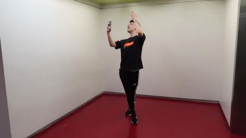 Black t-shirt with orange band worn by James Charles in DRESSING UP AS EACHOTHER feat. Dolan Twins & James Charles