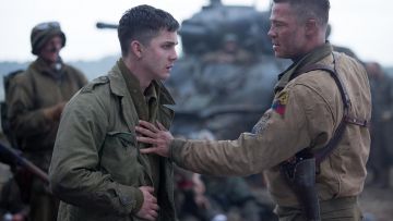 Norman Ellison (played by Logan Lerman) outfits on Fury