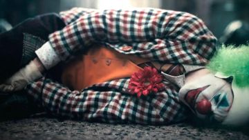 Checked overcoat worn by Arthur Fleck / The Joker (Joaquin Phoenix) as seen in Joker