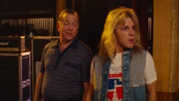 The jean jacket sleeveless Vince Neil (Daniel Webber) in The Dirt
