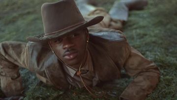 The beige shirt striped worn by Lil Sin X in his video clip Old Town Road feat. Billy Ray Cyrus