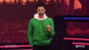 Green "Taxi" hoodie worn by Hasan Min­haj as seen in Pa­triot Act with Hasan Min­haj