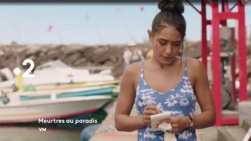 The blue dress with thin straps with printed white flowers worn by Joséphine Jobert in Murder in paradise Season 7 Episode 3 June 2019