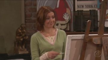 Red poster on the fireplace as seen in How I met your mother