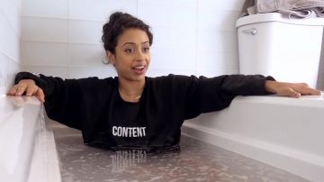 Black "CONTENT" Sweater worn by Liza Koshy in I HATE DOING THIS. BATH WITH LIZA! YouTube video