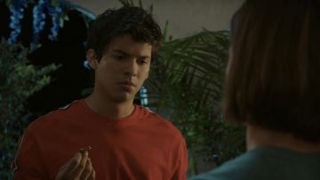 Orange long sleeve with white and black stripes on the collar area worn by worn by Miguel Diaz (Xolo Maridueña) in Cobra Kai (S02E07)