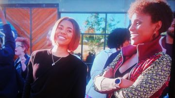 Red and yellow Jacket worn by  April Williams (Issa Rae) as seen in Little