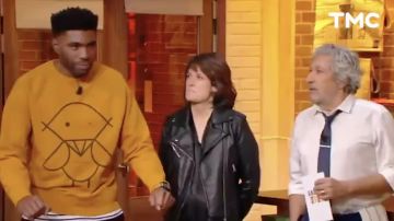 The sweatshirt mustard yellow worn by the candidate Larry in Burger Quiz