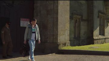 The jean jacket washed out with a hood and sleeves of the jersey of Adam Groff (Connor Swindells) in Sex Education (S02E02)