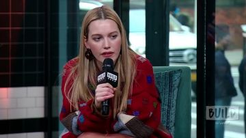 Red jacket worn by Victoria Pedretti in Victoria Pedretti Talks Season Two Of The Hit Netflix Series, "You" ITW video