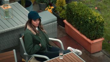 The green jacket khaki with fur collar of The Stranger (Hannah John-Kamen) in Bullying (Season 1 Episode 1)