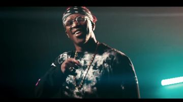 A black and white shirt of KSI in KSI – Houdini (feat. Swarmz & Tion Wayne) [Official Music Video]