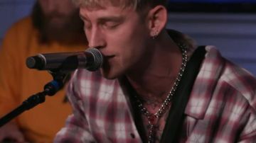 The silver chain worn by Machine Gun Kelly in the video MGK and Yungblud perform their hit song, "I Think I' m OKAY."