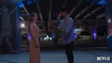 Sabrina Carpenter wears a yellow floral dress for her role as Quinn Ackerman in the Netflix movie Work It