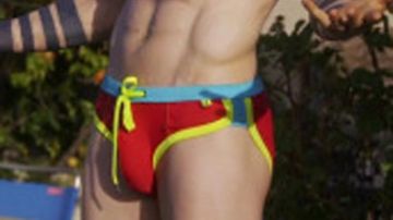 Men's red speedo-style swimsuit of Jay Kulina (Jonathan Tucker) in Kingdom (S02E08)