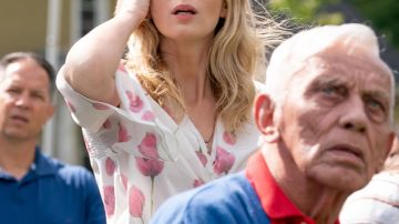 White and pink floral print flutter sleeve blouse worn by Evelyn Abbott (Emily Blunt) in A Quiet Place Part II